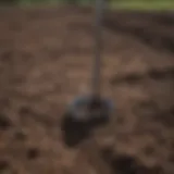 A detailed view of an AMS soil sampler in a field environment