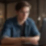 A scholar reviewing postdoctoral opportunities on a laptop.